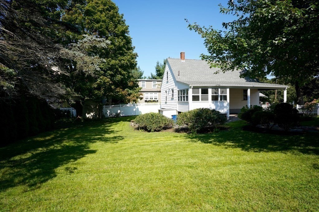 24 Peach Highlands Marblehead, MA 01945 - Photo 33 of 42 a front view of house with yard and green space