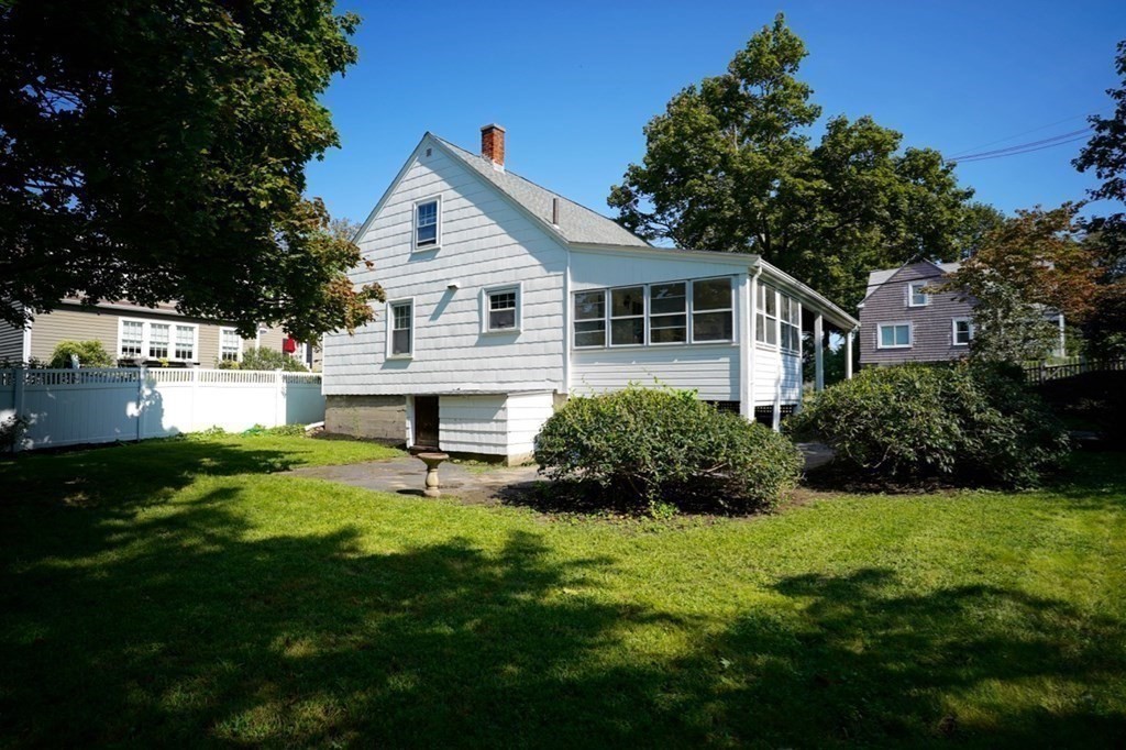 24 Peach Highlands Marblehead, MA 01945 - Photo 37 of 42 a front view of house with yard and green space