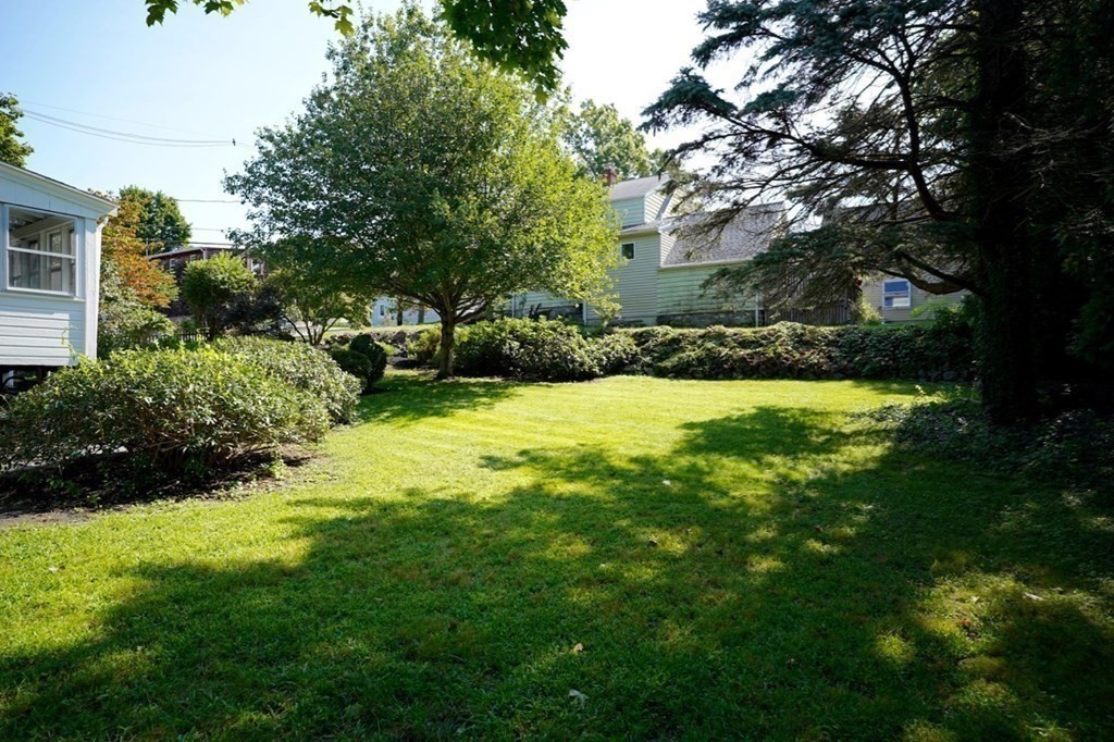 24 Peach Highlands Marblehead, MA 01945 - Photo 40 of 42 a view of a backyard with large trees