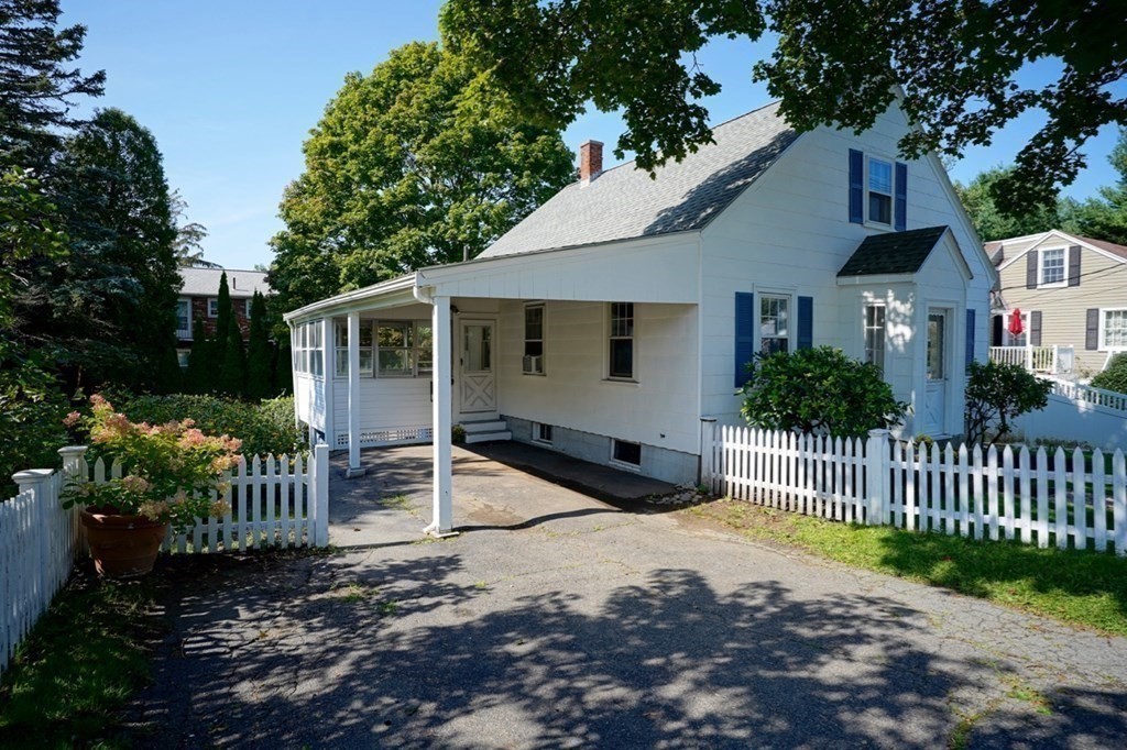 24 Peach Highlands Marblehead, MA 01945 - Photo 41 of 42 a view of a white house with a small yard and plants
