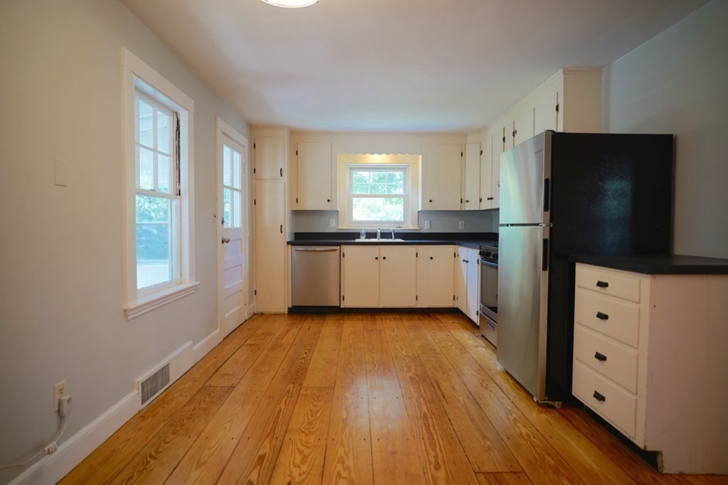 24 Peach Highlands Marblehead, MA 01945 - Photo 5 of 42 a kitchen with granite countertop a refrigerator stove and sink