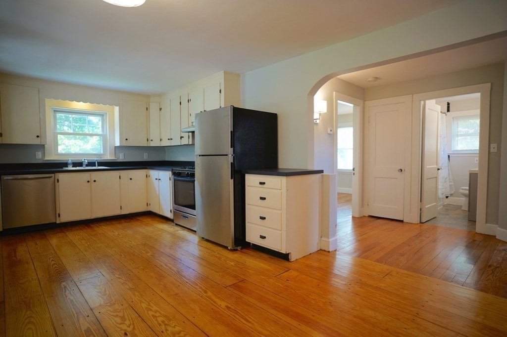 24 Peach Highlands Marblehead, MA 01945 - Photo 7 of 42 a kitchen with granite countertop a refrigerator and a sink