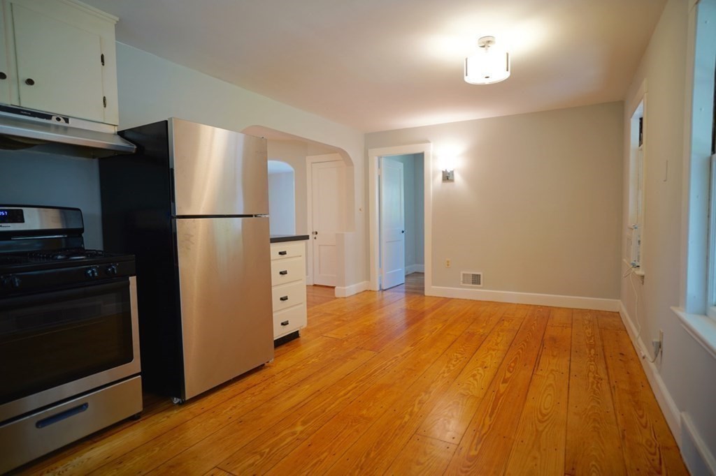 24 Peach Highlands Marblehead, MA 01945 - Photo 8 of 42 a view of a kitchen with a sink and a refrigerator