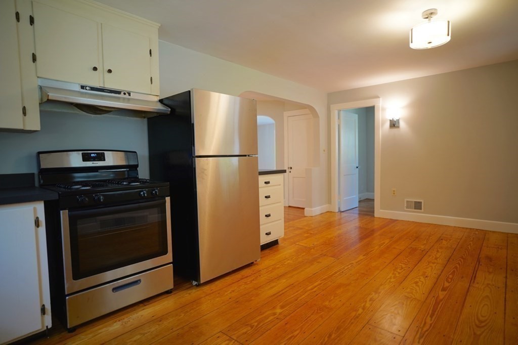 24 Peach Highlands Marblehead, MA 01945 - Photo 9 of 42 a kitchen with a refrigerator and a stove