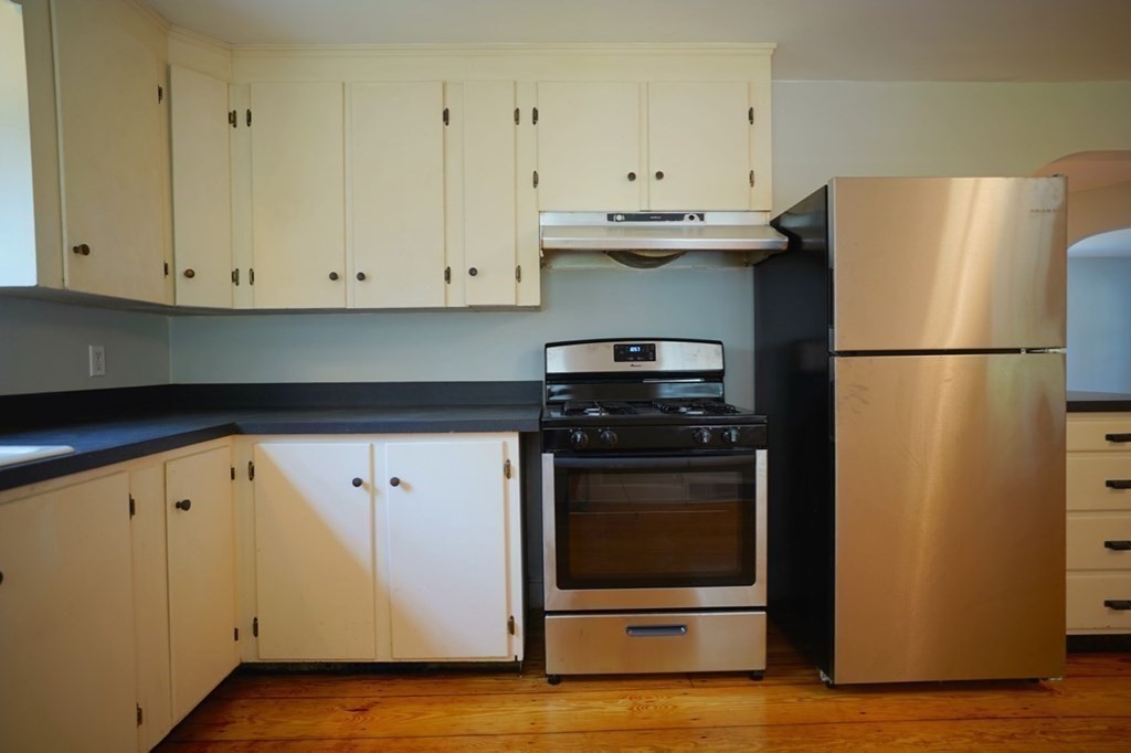 24 Peach Highlands Marblehead, MA 01945 - Photo 10 of 42 a kitchen with stainless steel appliances white cabinets and a refrigerator