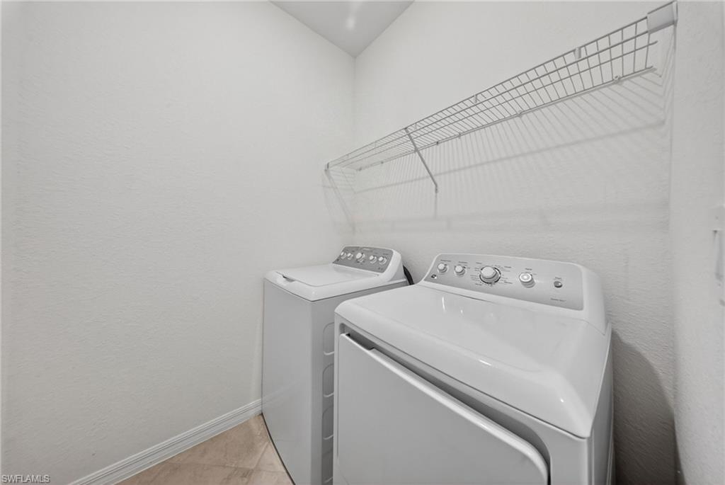 2196 Dragonfruit Way Naples, FL 34120 - Photo 19 of 50 a utility room with dryer and washer