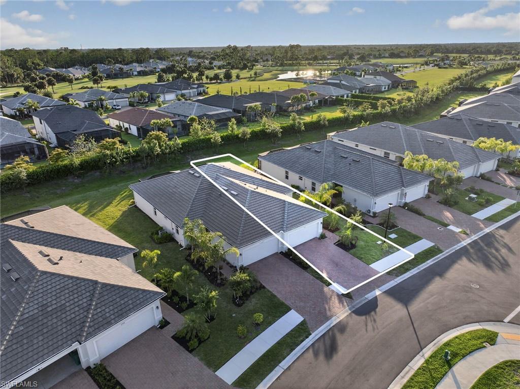 2196 Dragonfruit Way Naples, FL 34120 - Photo 22 of 50 an aerial view of residential houses with outdoor space