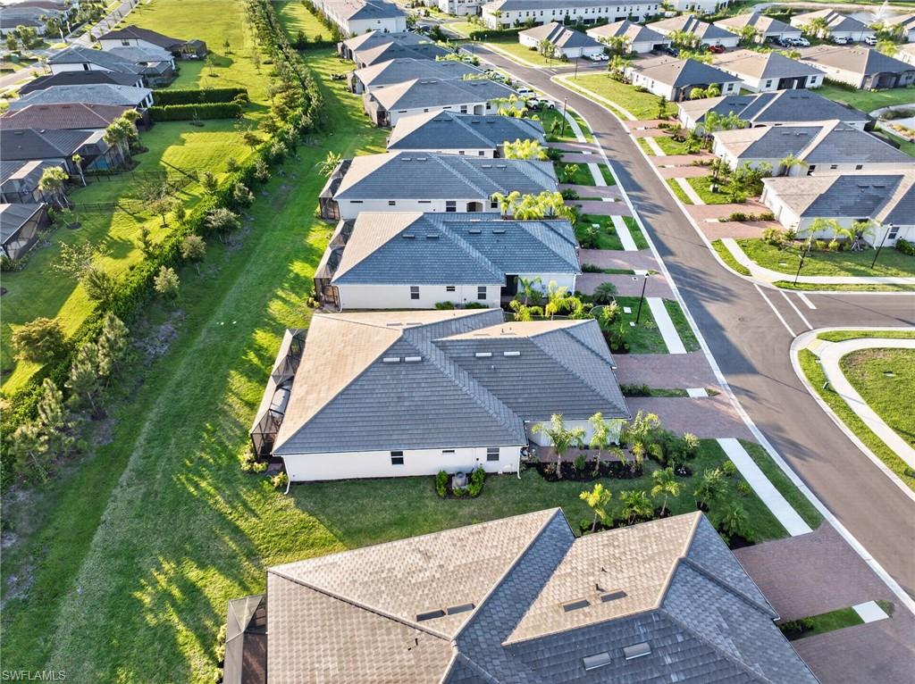 2196 Dragonfruit Way Naples, FL 34120 - Photo 25 of 50 an aerial view of a house with a garden