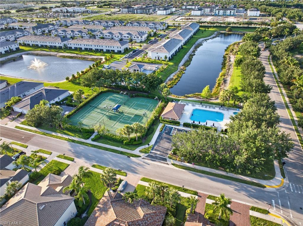 2196 Dragonfruit Way Naples, FL 34120 - Photo 27 of 50 an aerial view of residential houses with outdoor space and swimming pool