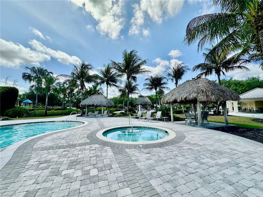 2196 Dragonfruit Way Naples, FL 34120 - Photo 36 of 50 a view of outdoor space yard and swimming pool