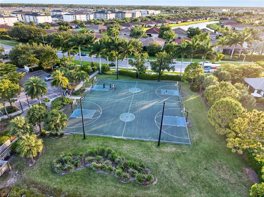 2196 Dragonfruit Way Naples, FL 34120 - Photo 44 of 50 an aerial view of a house with a yard