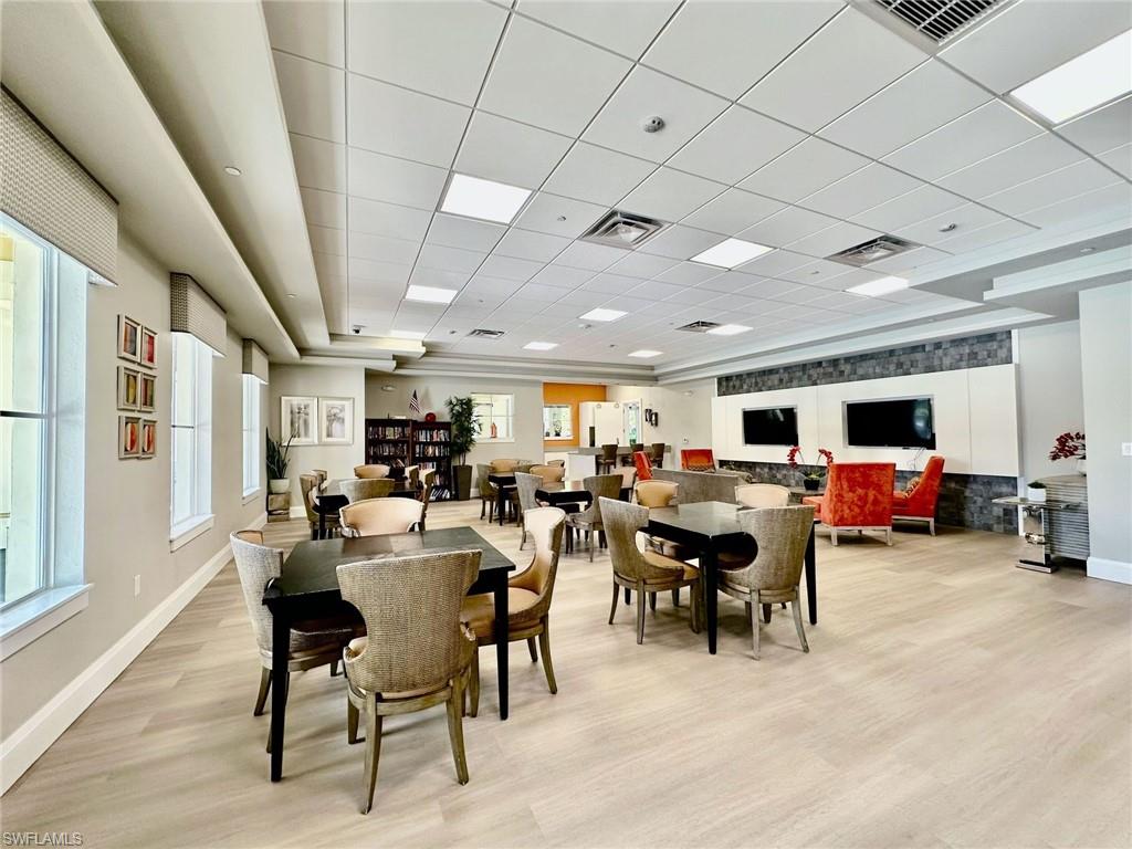 2196 Dragonfruit Way Naples, FL 34120 - Photo 48 of 50 a view of a dining area with furniture window and wooden floor