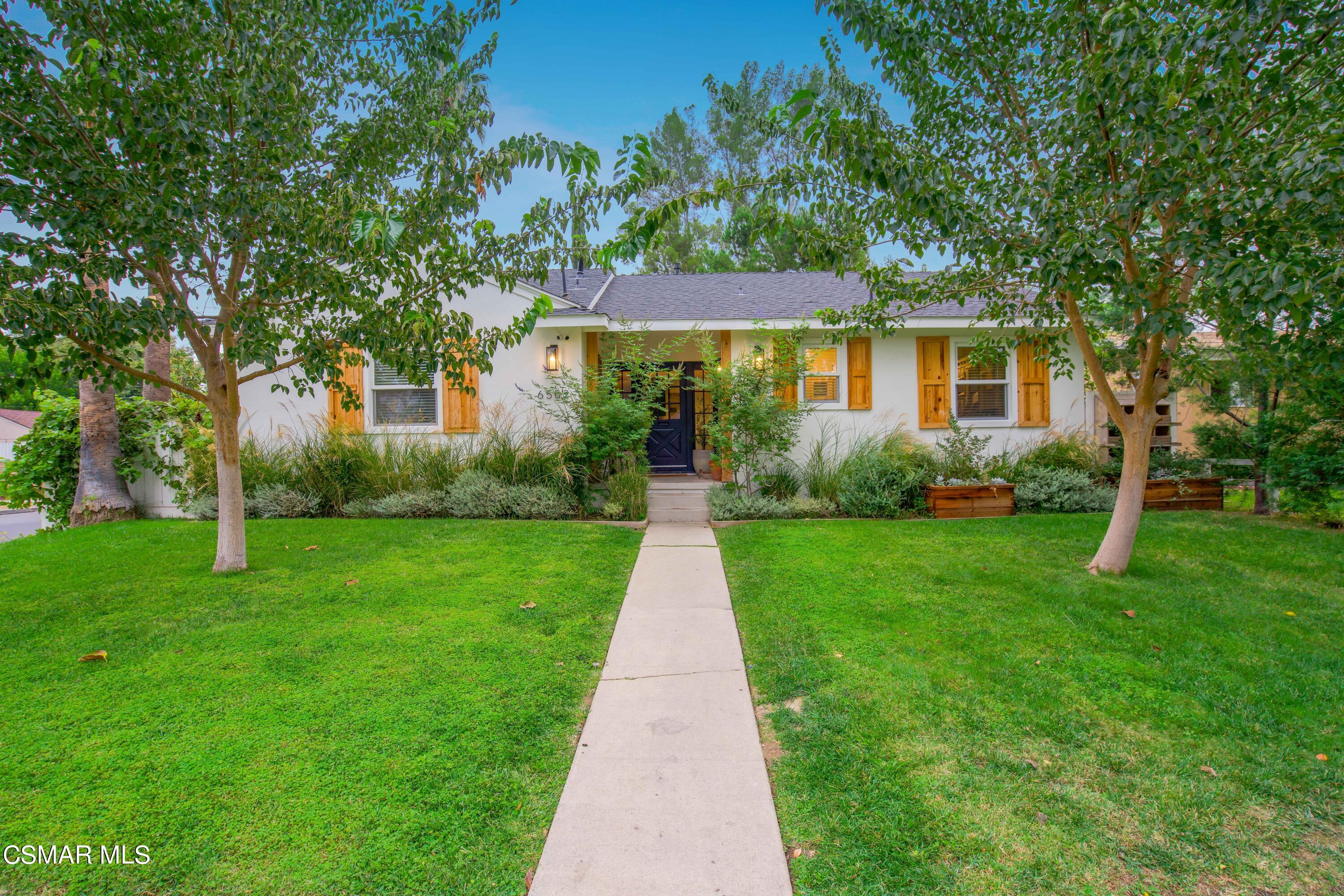 front view of a house with a yard
