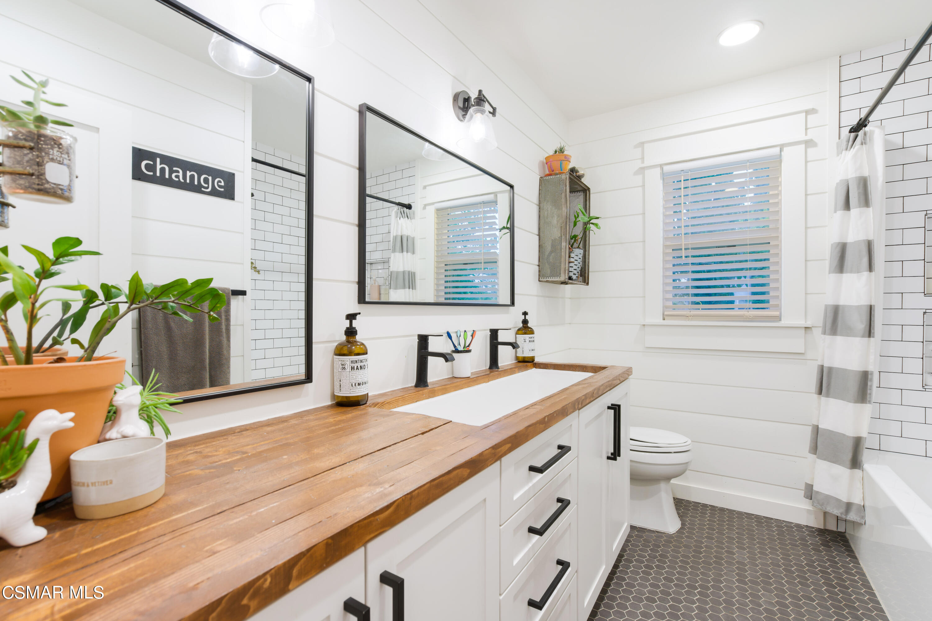 6552 Comanche Avenue Winnetka, CA 91306 - Photo 12 of 20 a bathroom with a granite countertop sink mirror vanity and toilet