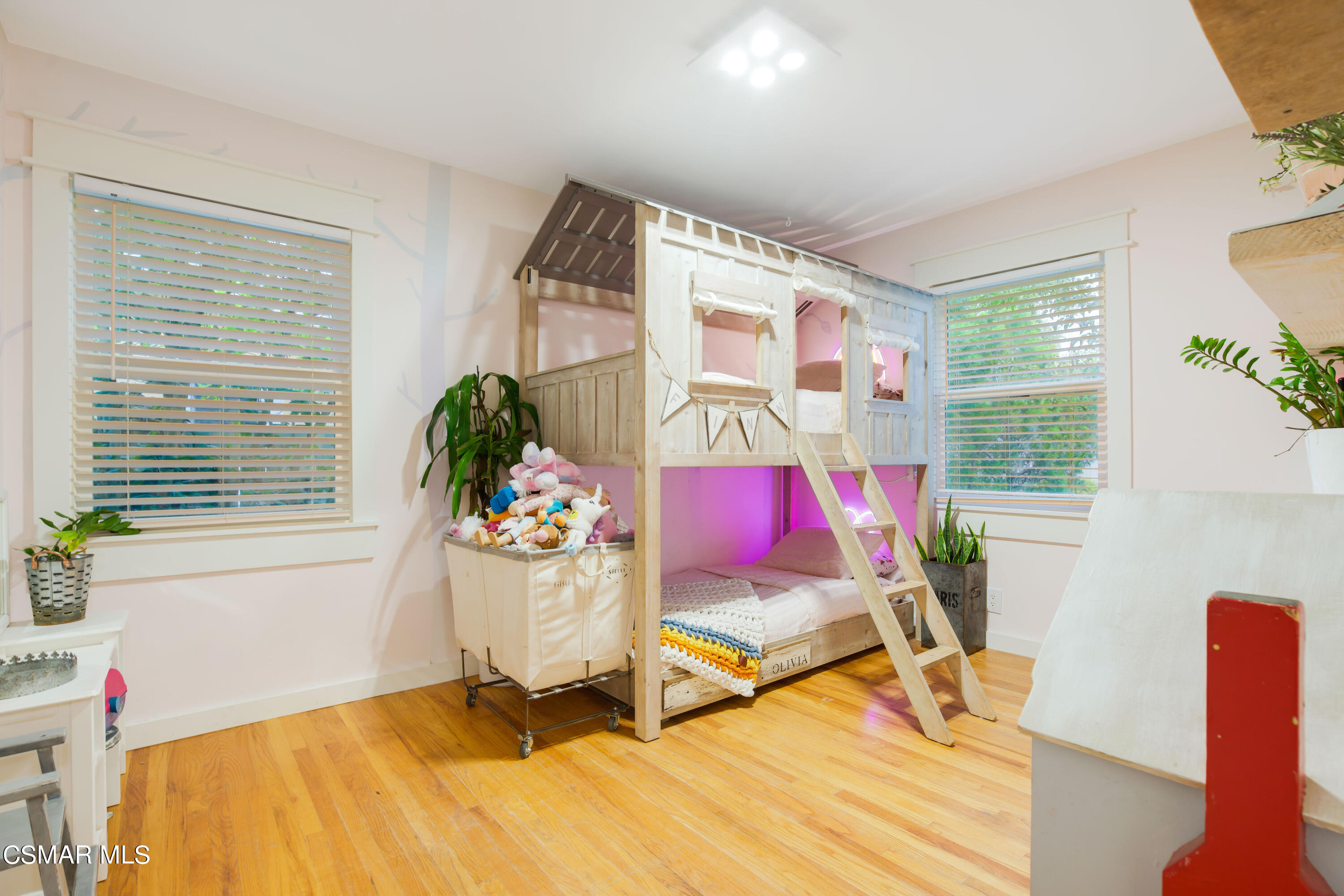 6552 Comanche Avenue Winnetka, CA 91306 - Photo 13 of 20 a bedroom with a bed and large windows