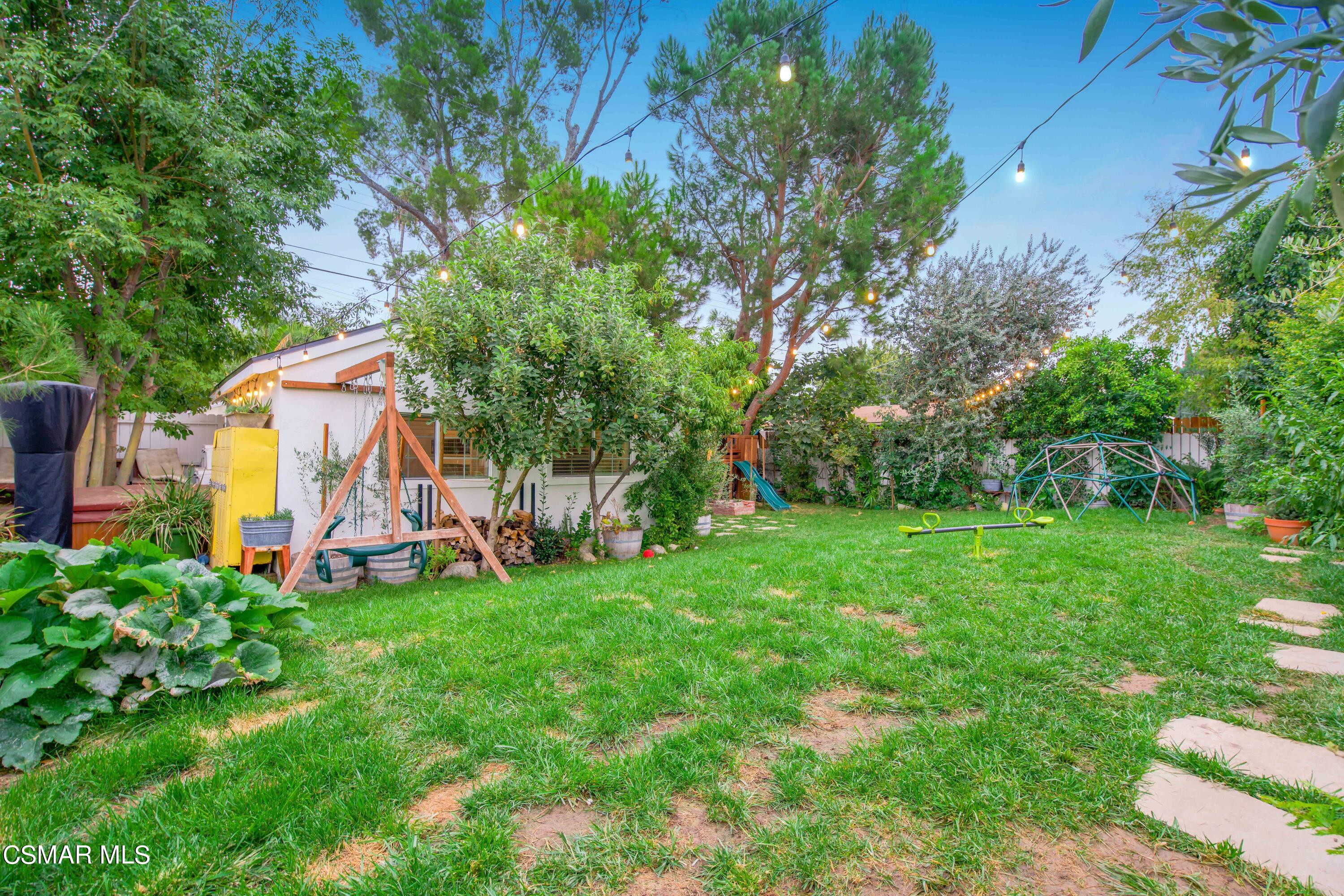 6552 Comanche Avenue Winnetka, CA 91306 - Photo 20 of 20 a view of a chair and table and garden