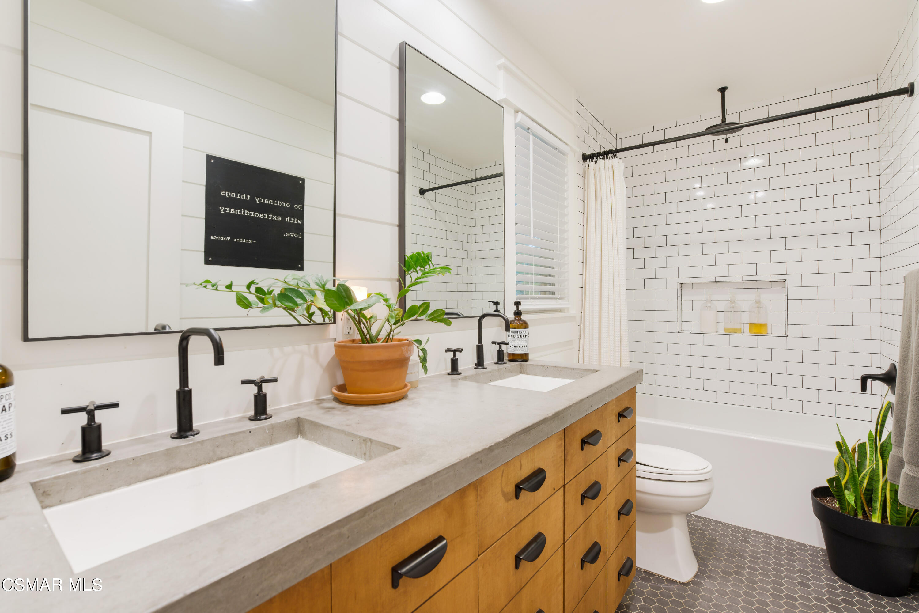 6552 Comanche Avenue Winnetka, CA 91306 - Photo 10 of 20 a bathroom with a granite countertop sink a toilet and mirror