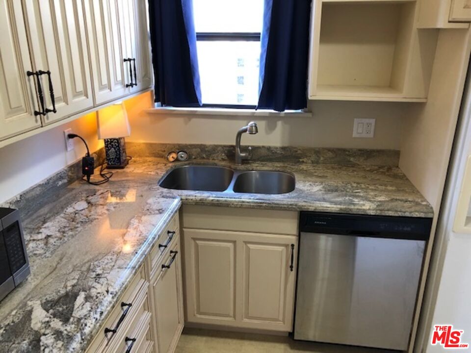 1927 Butler Avenue Los Angeles, CA 90025 - Photo 11 of 19 a kitchen with granite countertop a sink and a stove