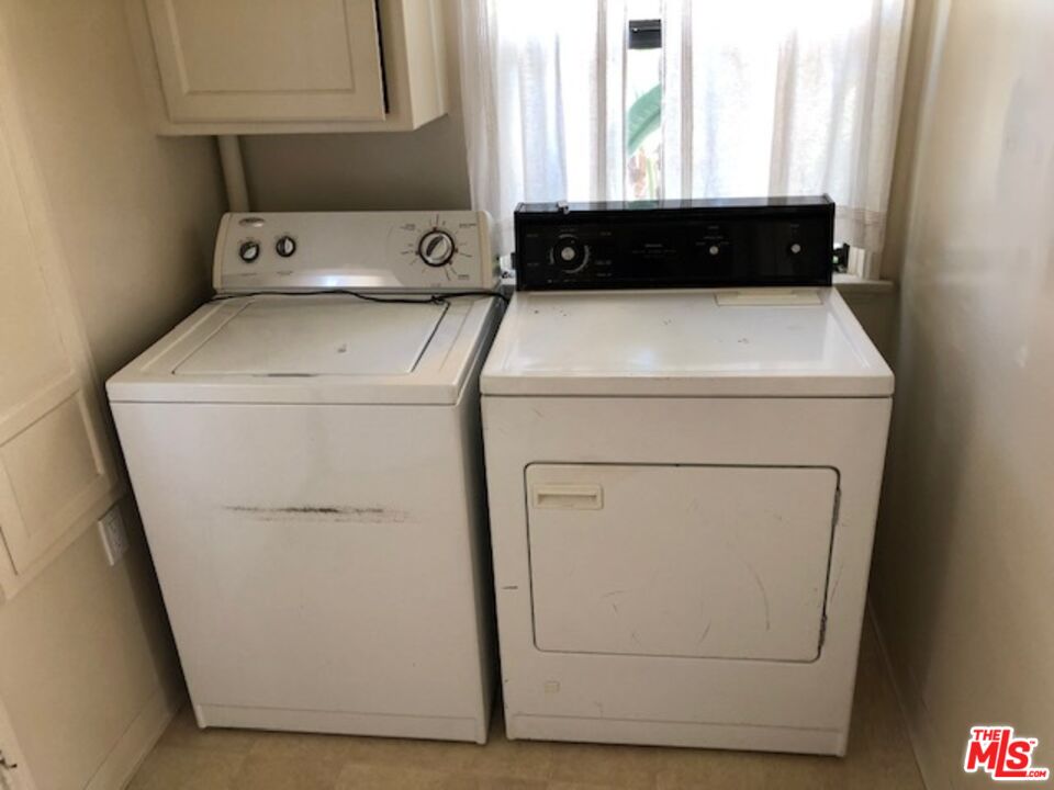 1927 Butler Avenue Los Angeles, CA 90025 - Photo 19 of 19 a utility room with dryer and washer