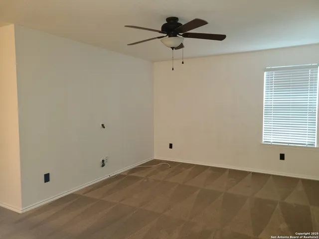 a view of a big room with carpet