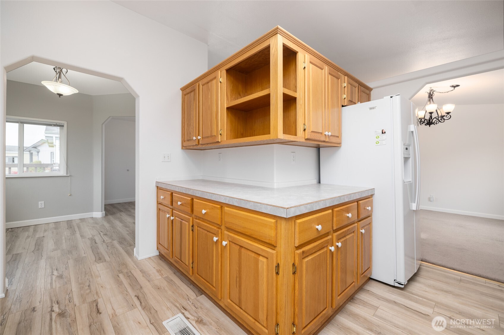 2610 East Section Street, Unit 112 Mount Vernon, WA 98274 - Photo 12 of 34 a kitchen with stainless steel appliances cabinets and wooden floor
