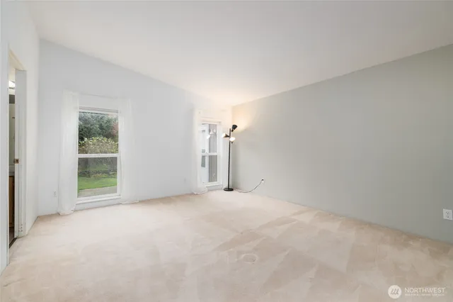 a view of empty room with windows