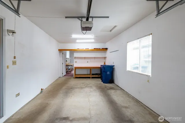 a view of a livingroom with a furniture a ceiling fan and window