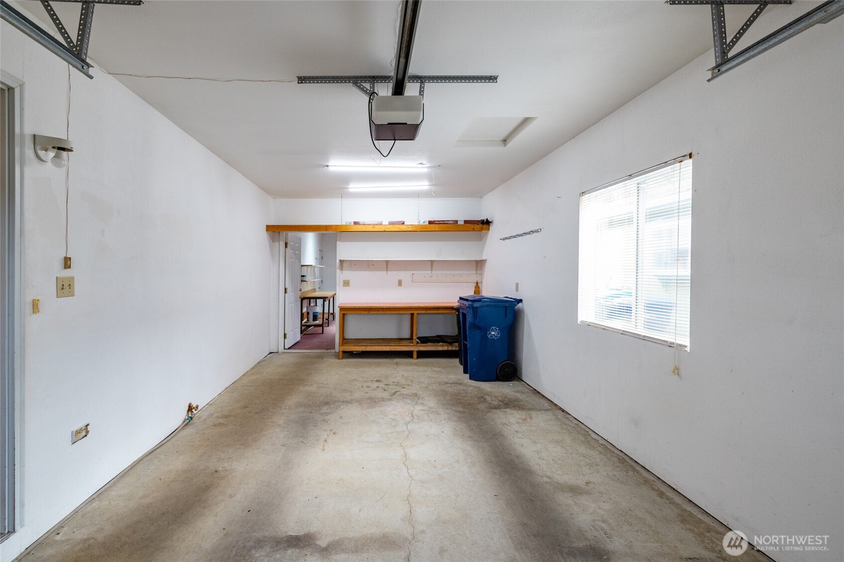 2610 East Section Street, Unit 112 Mount Vernon, WA 98274 - Photo 23 of 34 a view of a livingroom with a furniture a ceiling fan and window