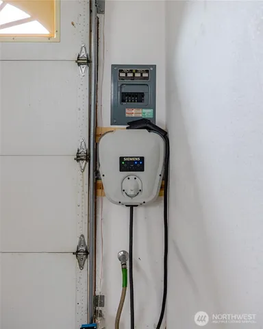 a hallway with sliding door and mirror