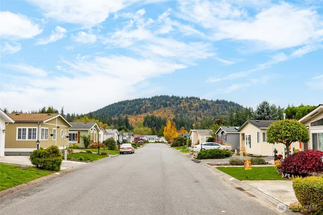 a view of multiple houses with a street