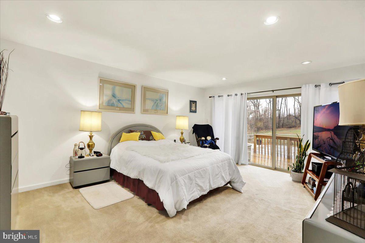 120 Deysher Road Fleetwood, PA 19522 - Photo 17 of 50 a bedroom with a bed and large windows