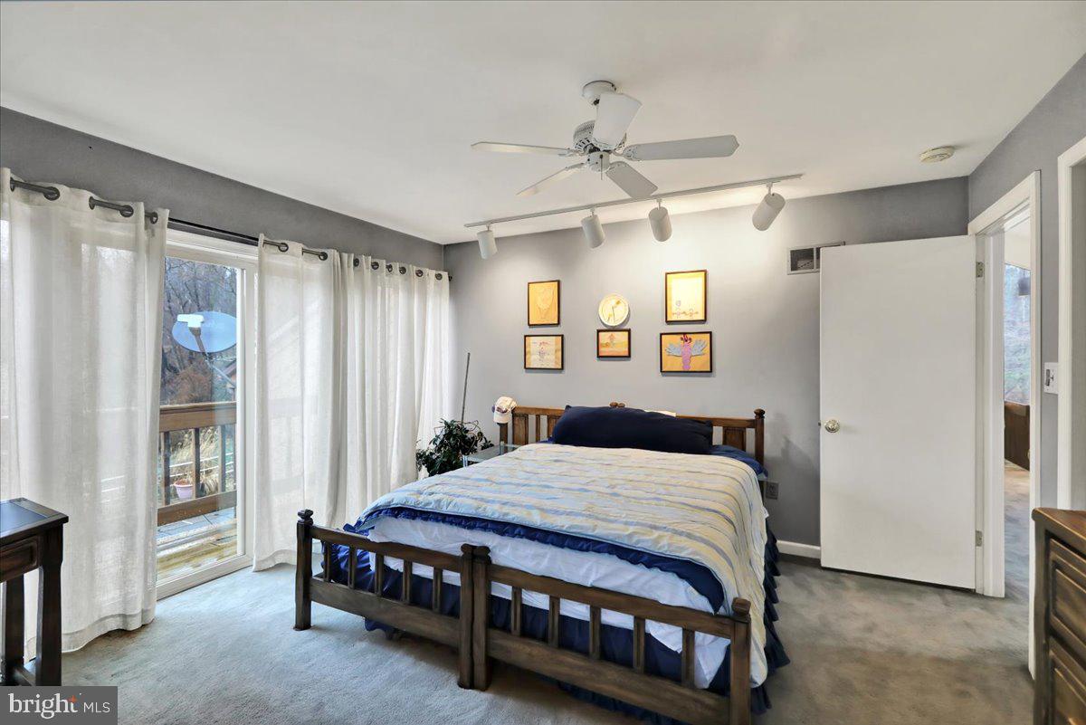 120 Deysher Road Fleetwood, PA 19522 - Photo 29 of 50 a bedroom with a bed mirror and a window