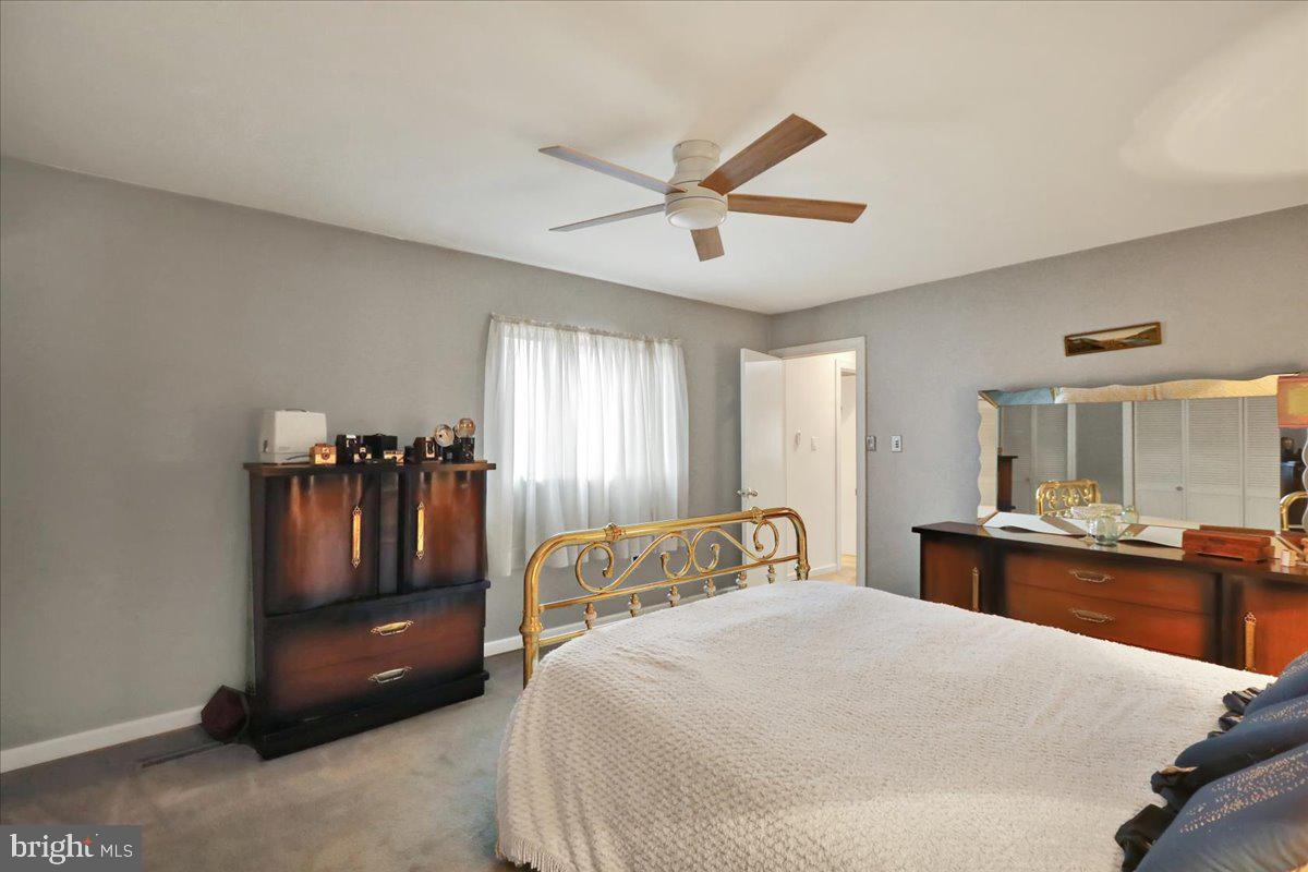 120 Deysher Road Fleetwood, PA 19522 - Photo 32 of 50 a bedroom with a bed and a chandelier