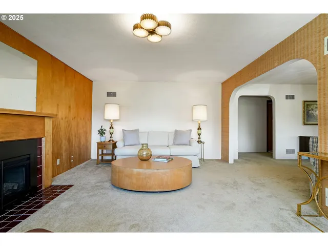 a bedroom with furniture and a fireplace