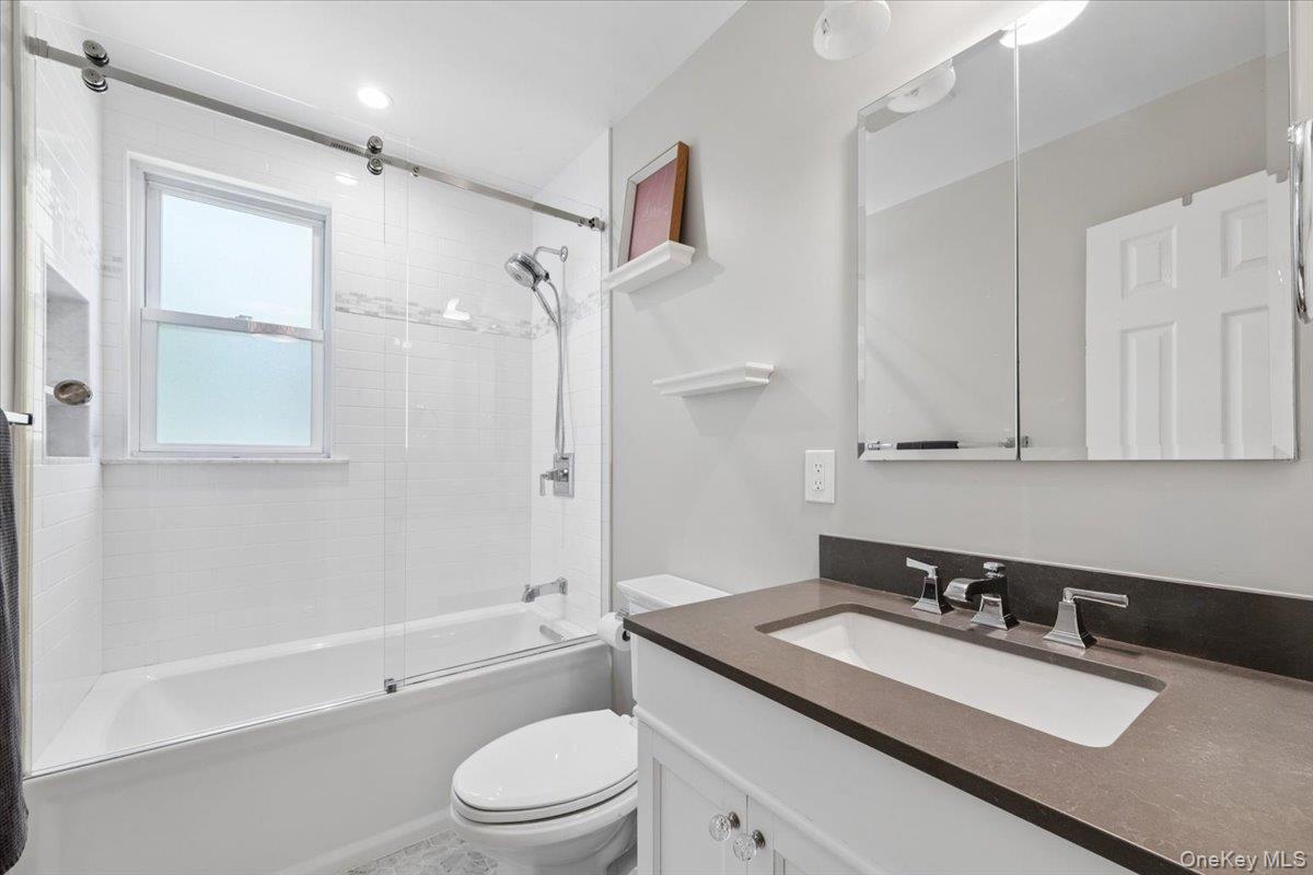 51 Avon Circle, Unit D Rye Brook, NY 10573 - Photo 22 of 30 Renovated full bathroom in the hall includes a bathtub