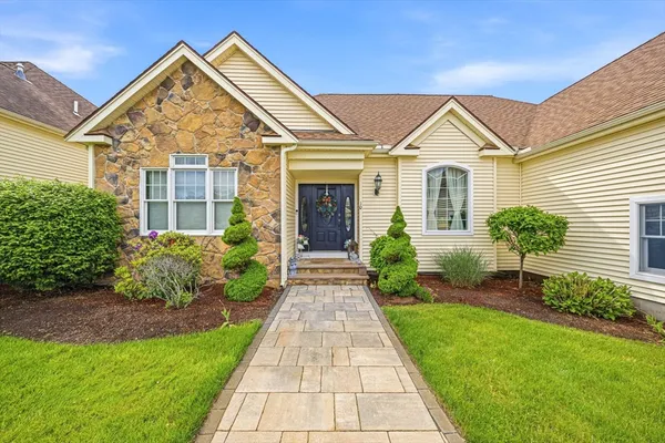 front view of a house and a yard