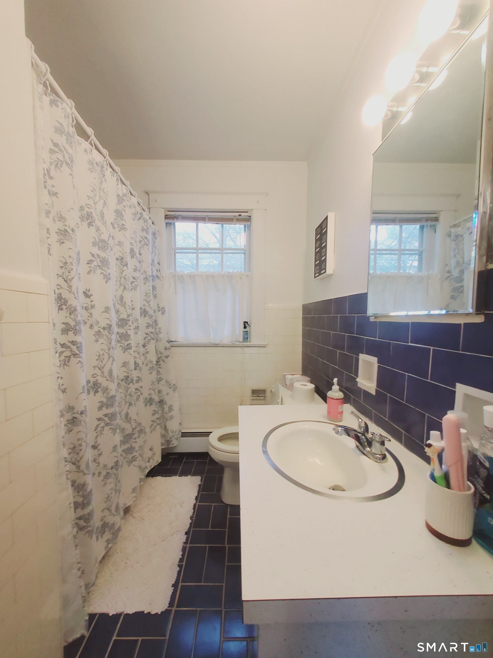 100 Colonial Road, Unit 2 Stamford, CT 06906 - Photo 6 of 8 a bathroom with a sink and a mirror