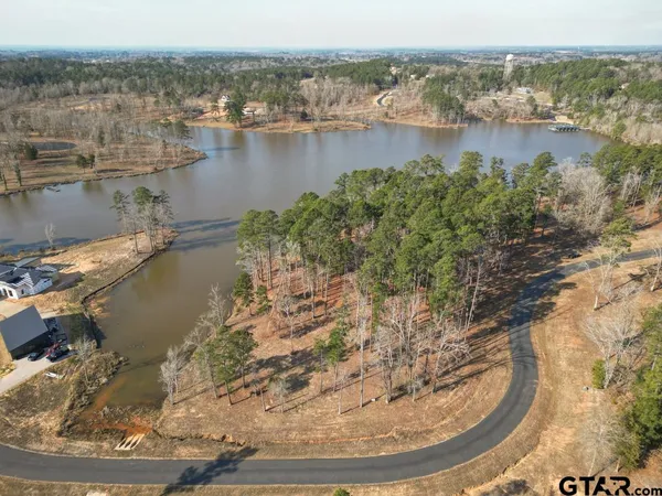 a view of a lake with tall buildings