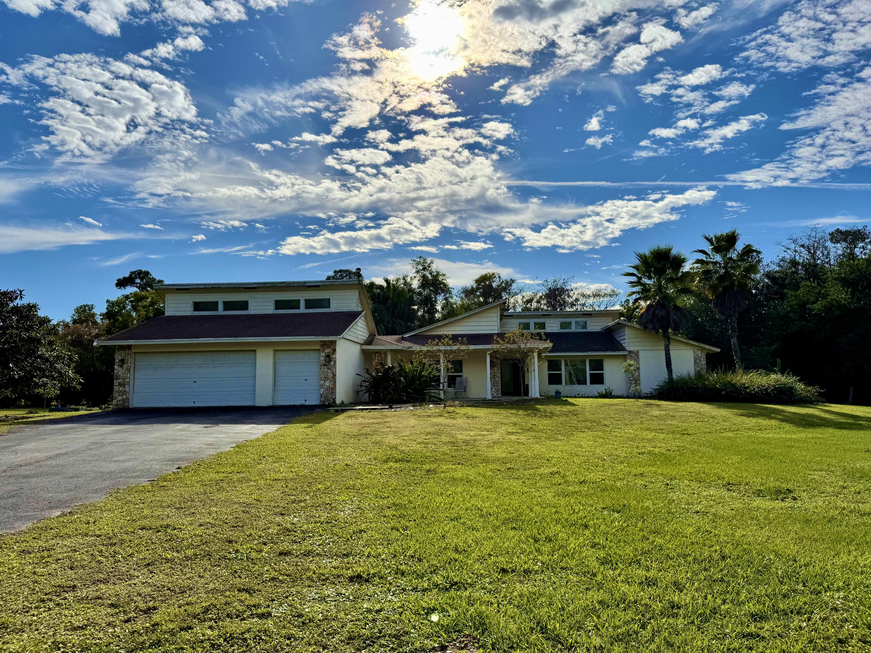 17375 173rd Road North Jupiter, FL 33478 - Photo 65 of 77 FRONT WITH GARAGES