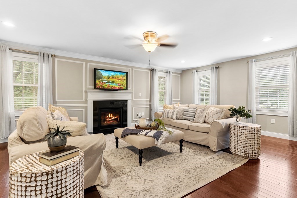 2 Georgianna Road Billerica, MA 01821 - Photo 14 of 41 a living room with furniture a fireplace with wooden floor