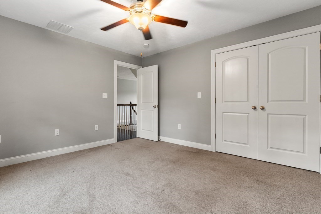 2 Georgianna Road Billerica, MA 01821 - Photo 25 of 41 an empty room with chandelier fan
