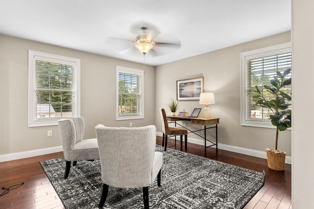 2 Georgianna Road Billerica, MA 01821 - Photo 5 of 41 a workspace with wooden floor and a rug