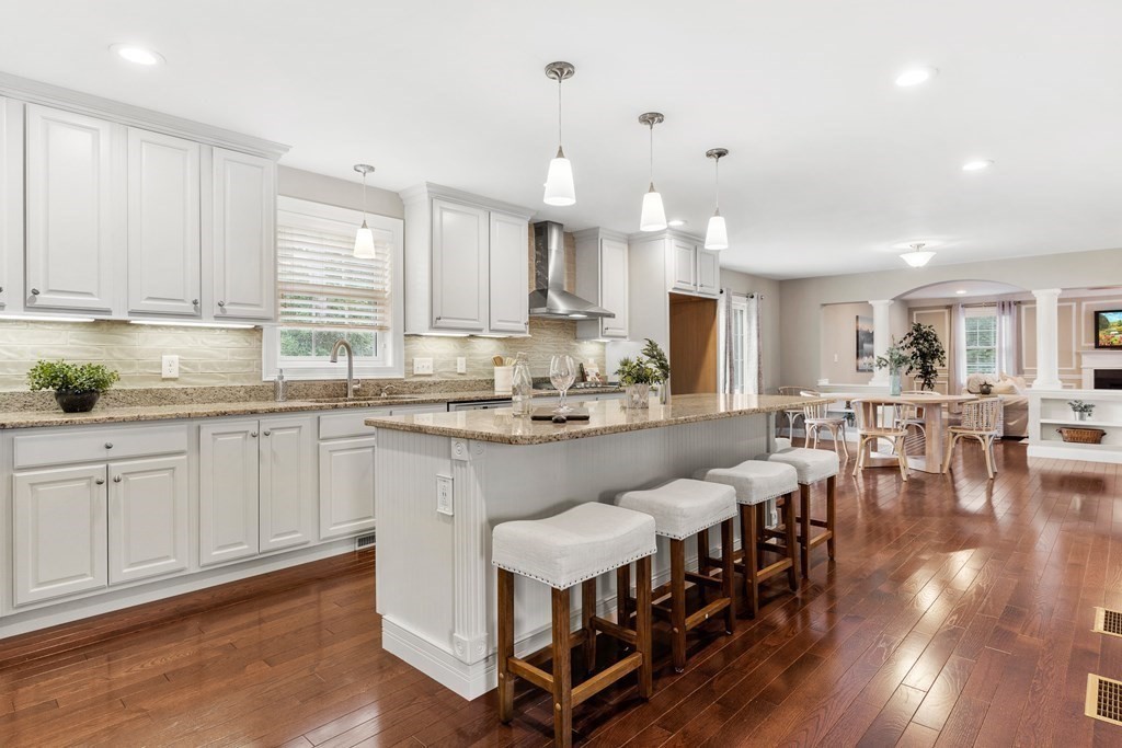 2 Georgianna Road Billerica, MA 01821 - Photo 6 of 41 a kitchen with stainless steel appliances kitchen island granite countertop lots of white cabinets appliances and furniture