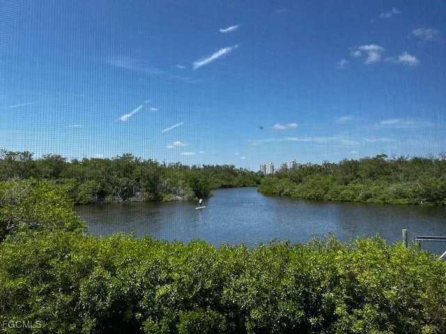 a view of lake with green space