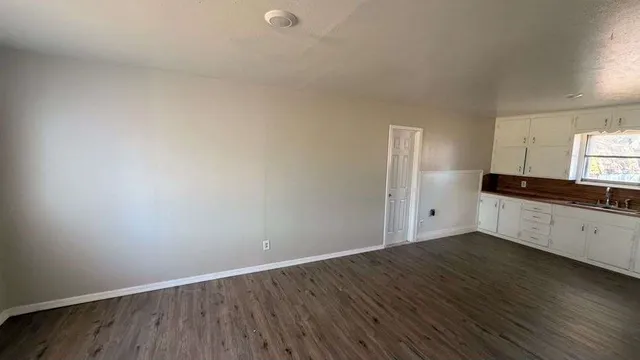 a view of kitchen with wooden floor
