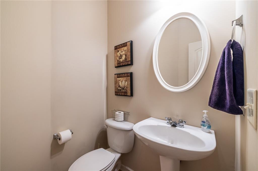 154 Trailside Way Hiram, GA 30141 - Photo 20 of 44 a bathroom with a toilet a sink and a mirror