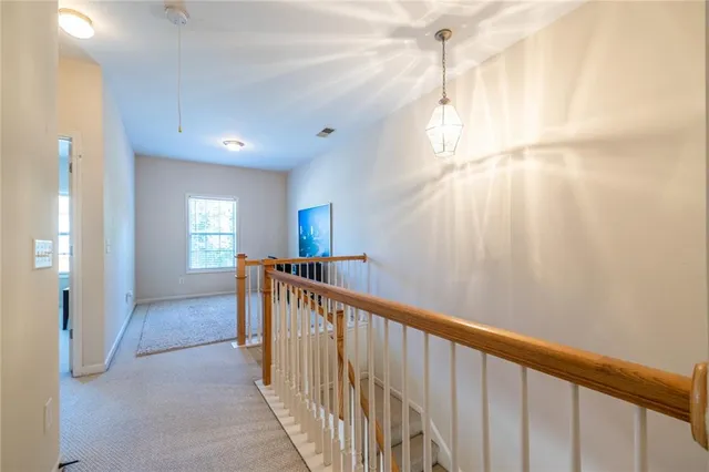a view of hallway with windows