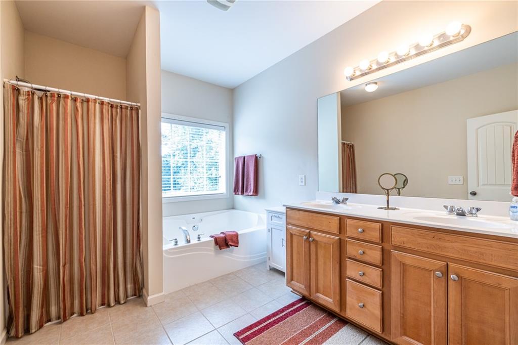 154 Trailside Way Hiram, GA 30141 - Photo 29 of 44 a bathroom with a sink and a mirror