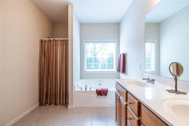a bathroom with a sink double vanity and a mirror