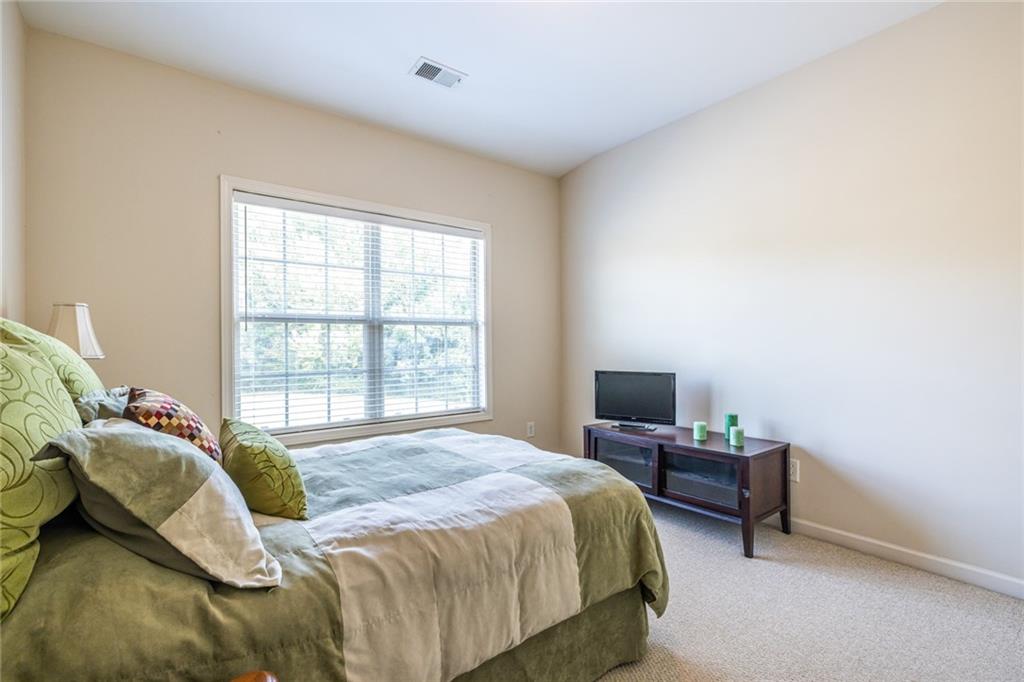 154 Trailside Way Hiram, GA 30141 - Photo 34 of 44 a bedroom with a bed tv and a window